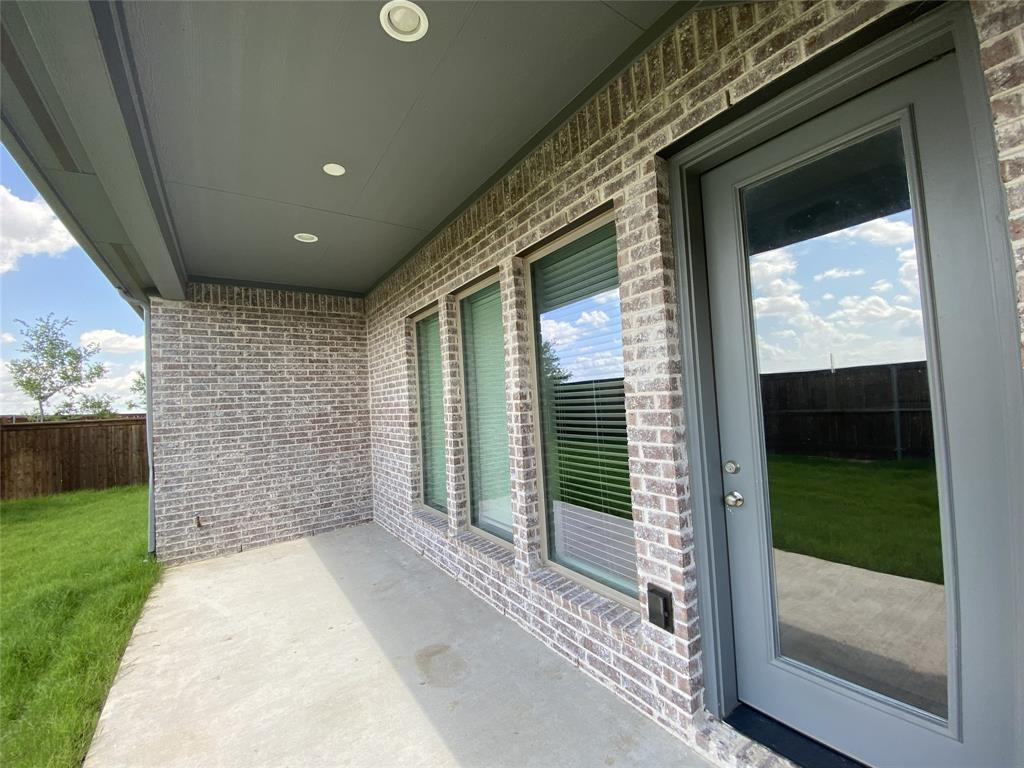 1937 Halkin Road Celina, TX 75009 - Photo 20 of 20 Covered patio featuring a concrete slab, brick exterior, recessed lighting, and a glass-paneled door
