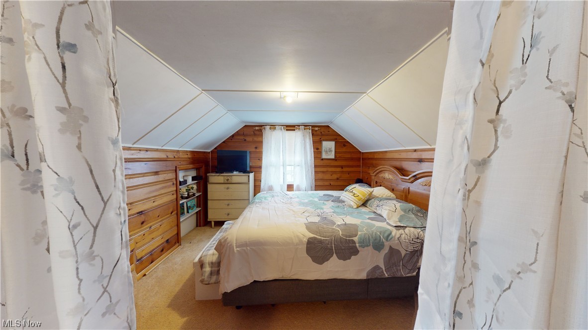1331 Churchill Road Lyndhurst, OH 44124 - Photo 24 of 35 Bedroom featuring lofted ceiling, wooden walls, and light carpet