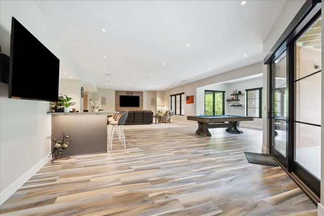 a living room with fireplace furniture and a flat screen tv