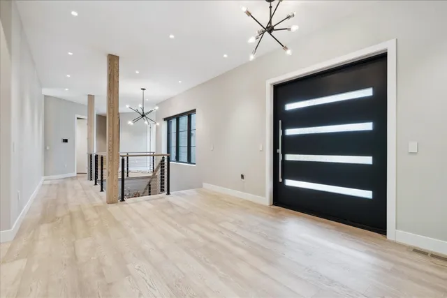 a view of an empty room with a cabinet