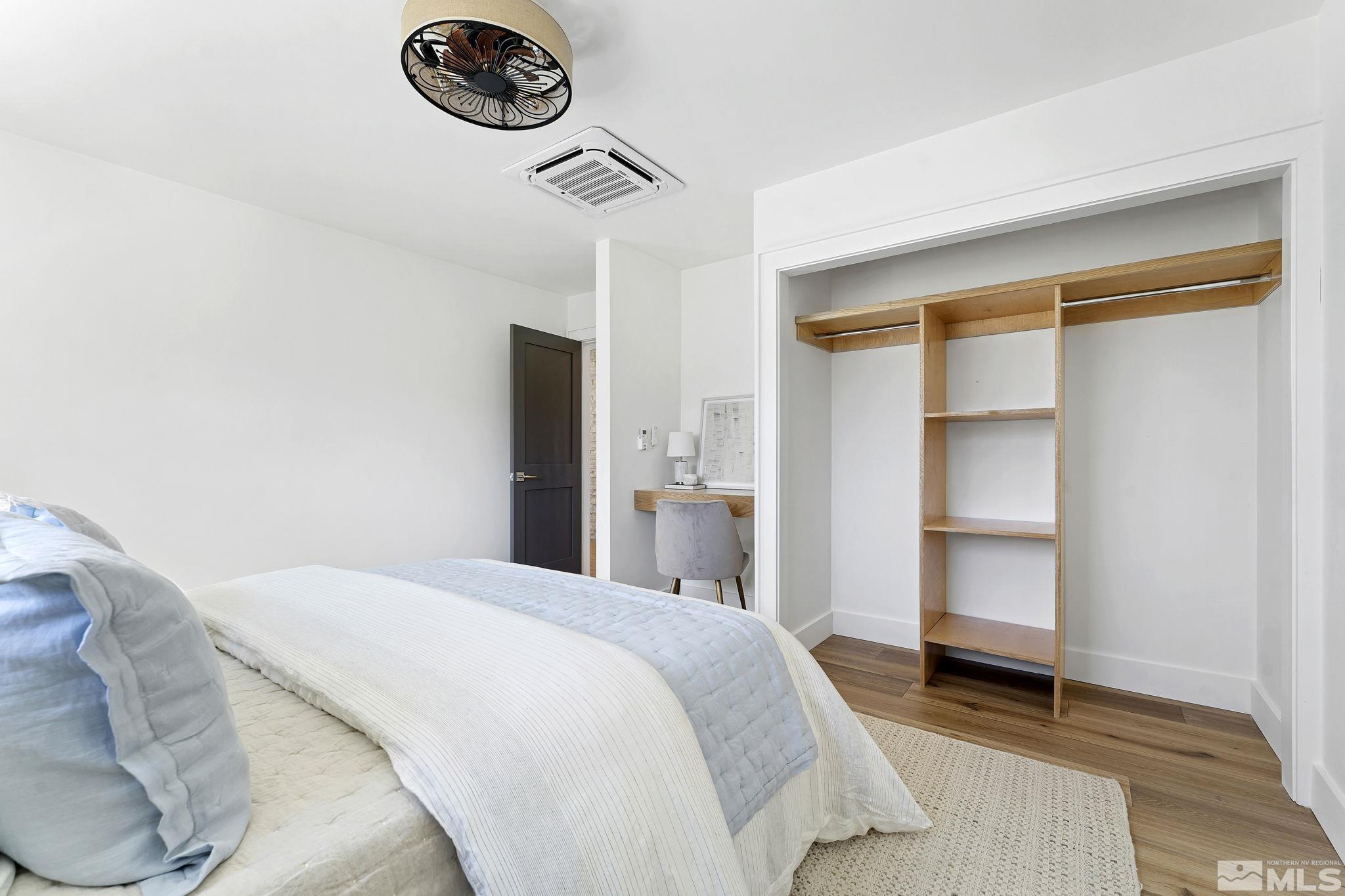 2620 Del Monte Lane Reno, NV 89511 - Photo 27 of 40 a bedroom with a bed and a chandelier