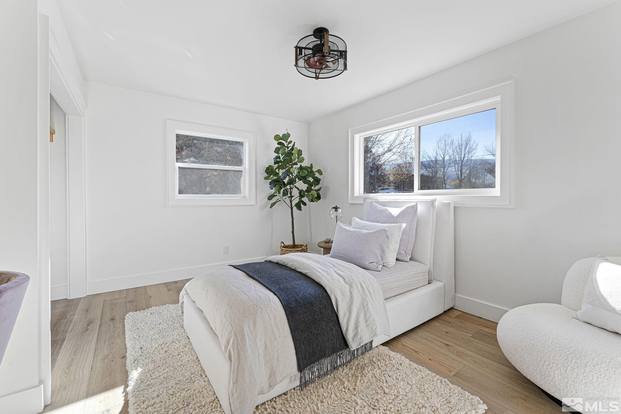 2620 Del Monte Lane Reno, NV 89511 - Photo 29 of 40 a bedroom with a bed and a couch