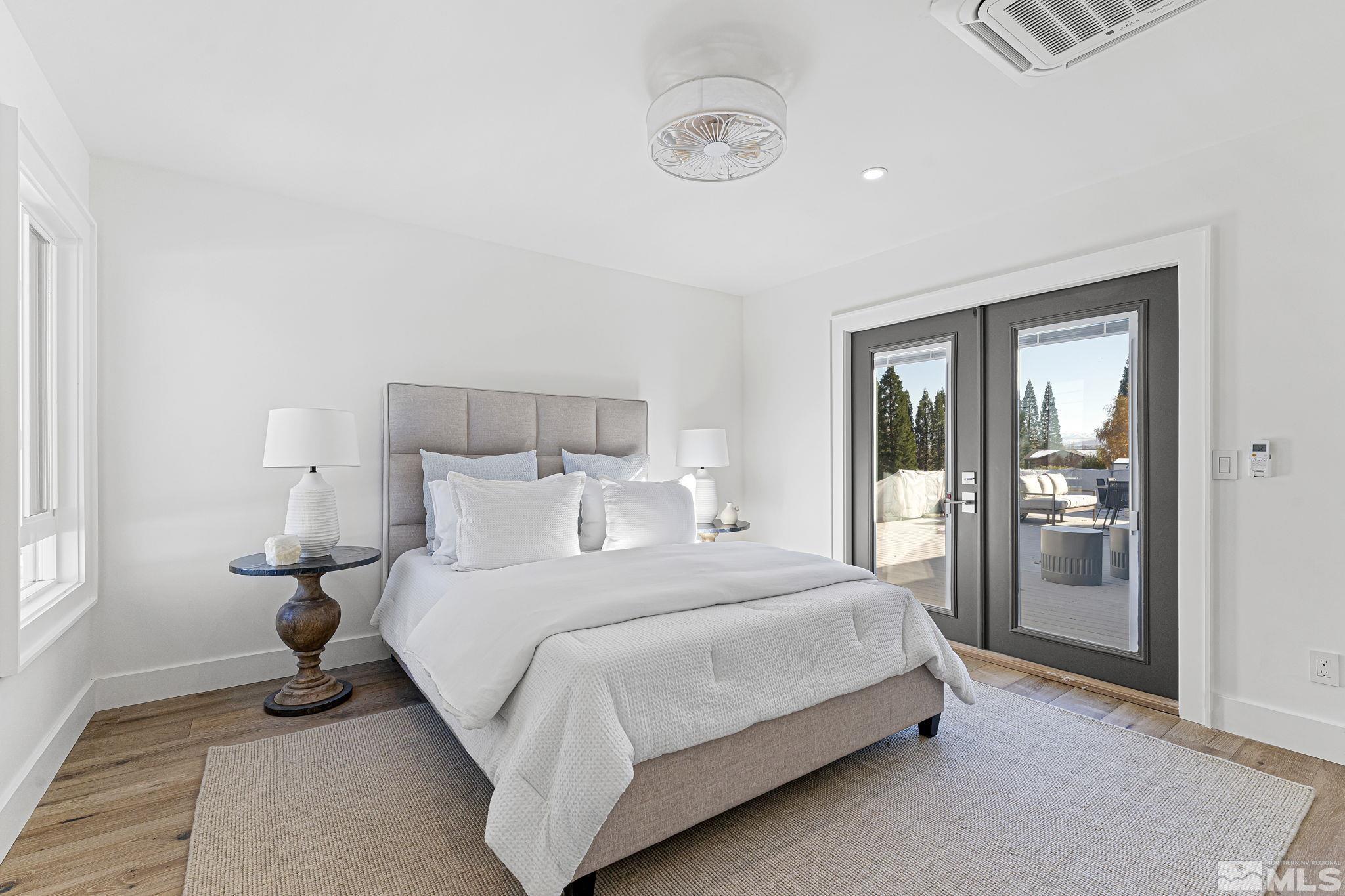 2620 Del Monte Lane Reno, NV 89511 - Photo 31 of 40 a bedroom with a bed and a night stand