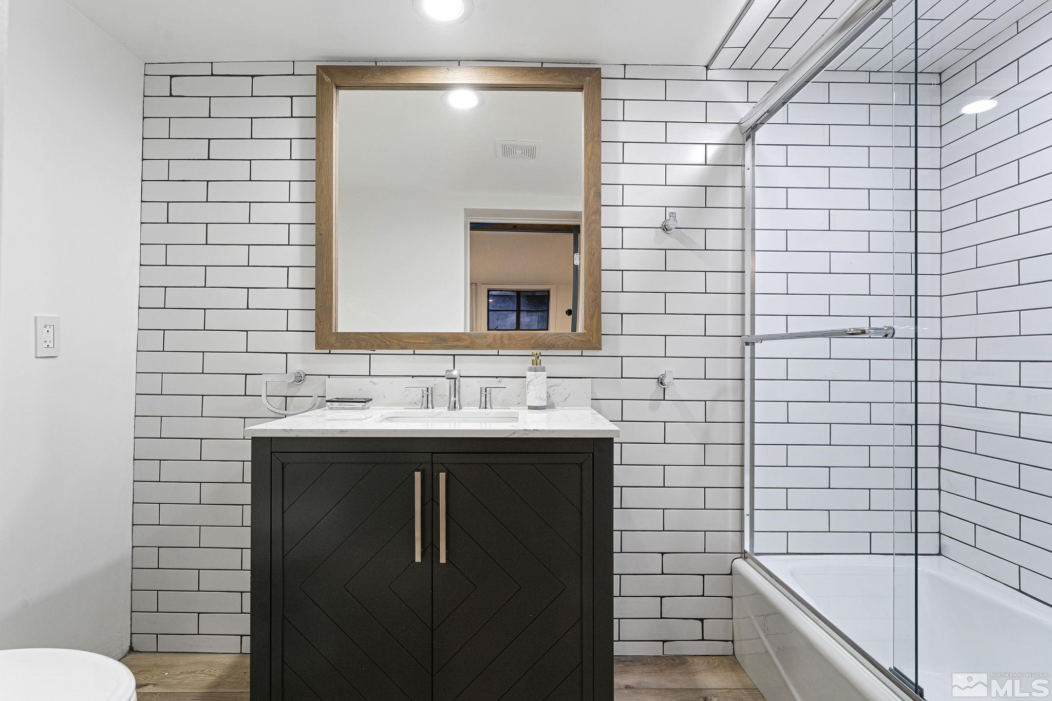 2620 Del Monte Lane Reno, NV 89511 - Photo 39 of 40 a bathroom with a sink and a mirror