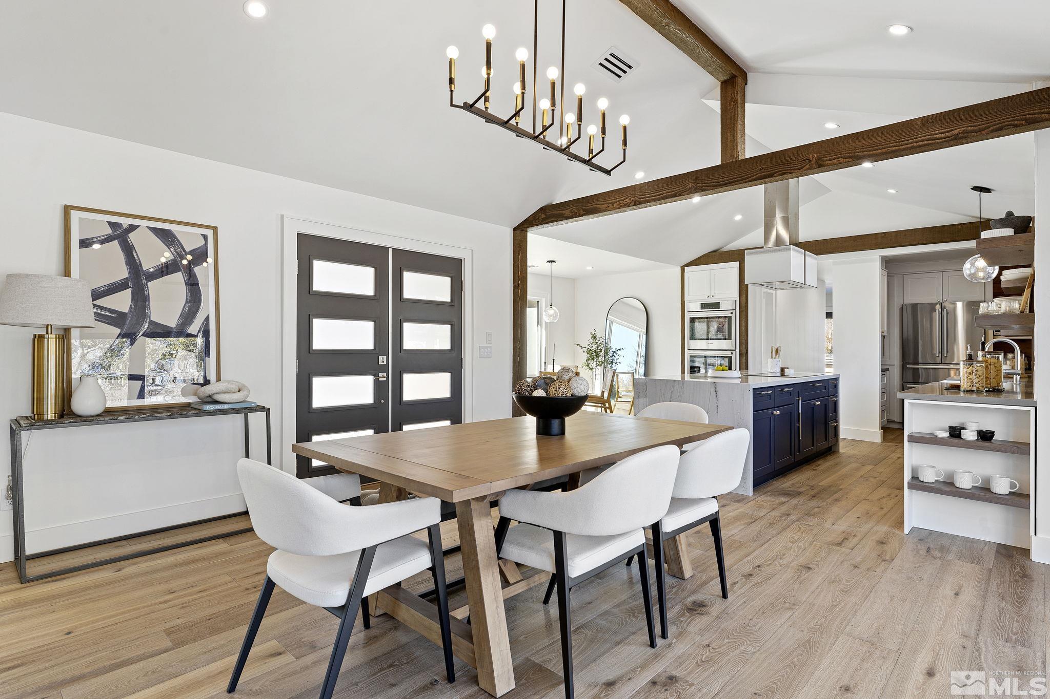 2620 Del Monte Lane Reno, NV 89511 - Photo 6 of 40 a view of a dining room with furniture and wooden floor