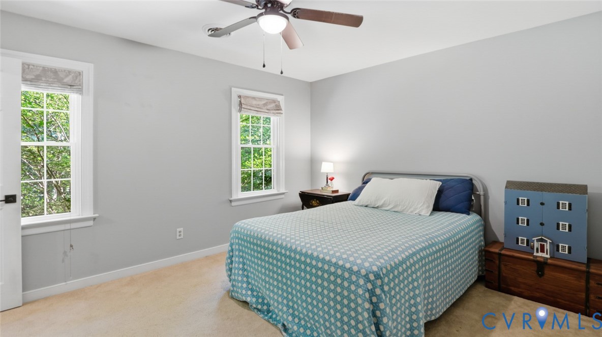 10716 Chalkley Road Richmond, VA 23237 - Photo 32 of 46 a bedroom with a bed and a window