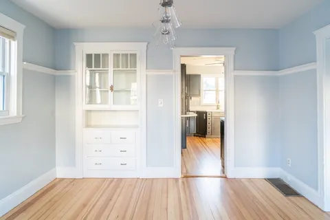 wooden floor in a room with a window