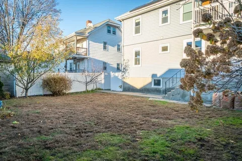 a house view with a backyard space