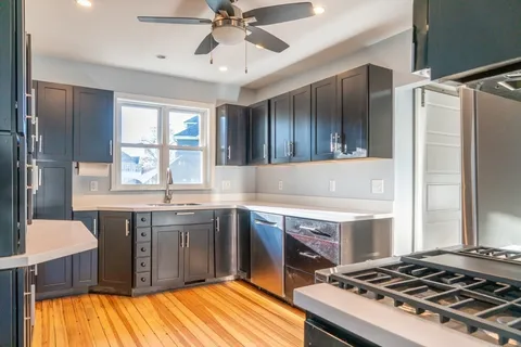 a kitchen with a stove and a sink