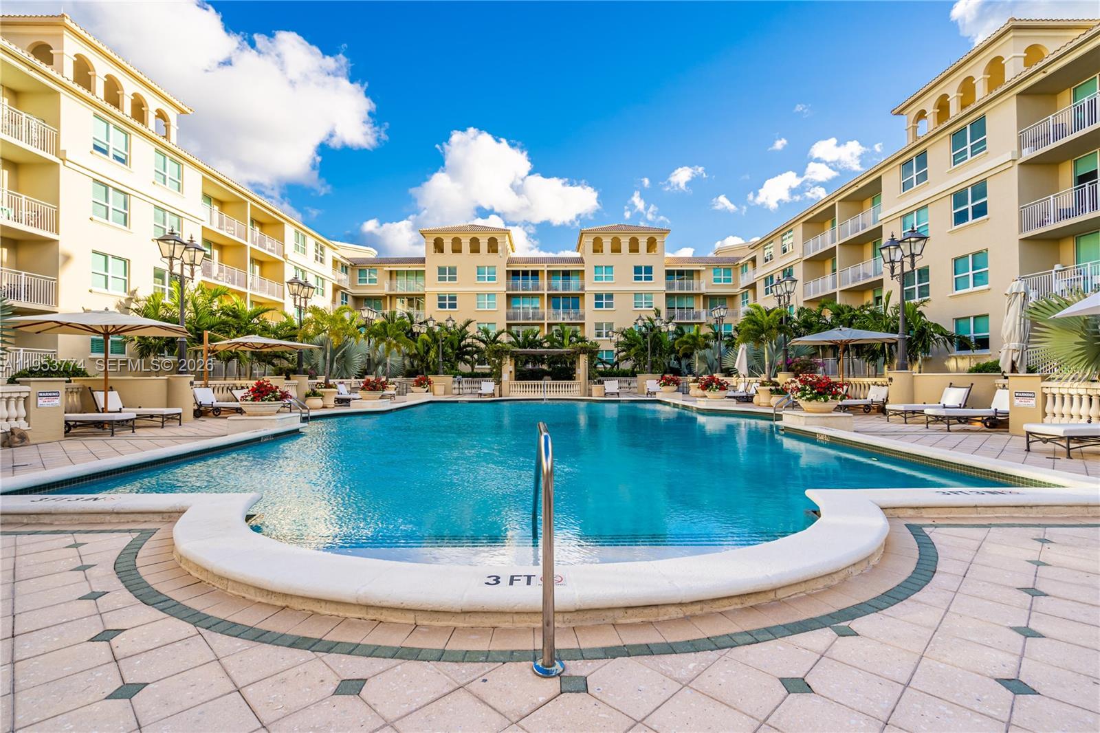 99 Southeast Mizner Boulevard, Unit 409 Boca Raton, FL 33432 - Photo 23 of 26 a swimming pool with outdoor seating and barbeque oven