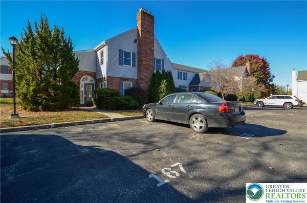 a view of a car parked in front of a house