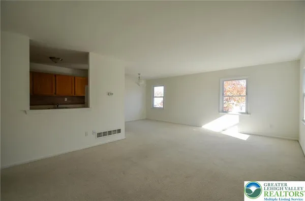 a view of an empty room and window