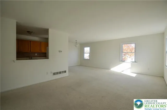 a view of an empty room and window