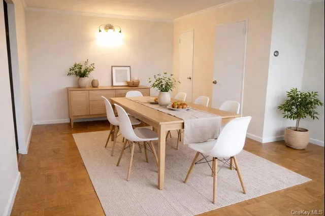 a view of a dining room with furniture and wooden floor