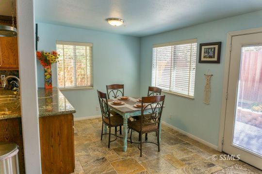 718 La Paloma Street Ridgecrest, CA 93555 - Photo 27 of 50 a view of a dining room with furniture and window