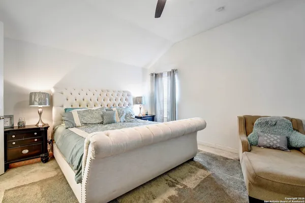 a bedroom with a bed and couch