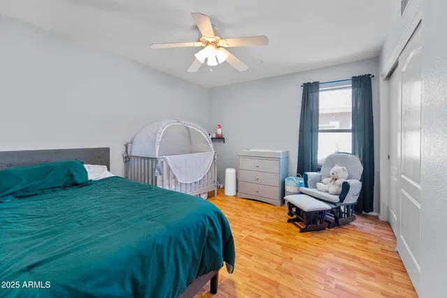 a bedroom with furniture and a window
