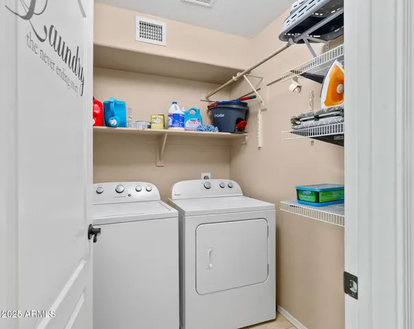 a bathroom with a sink a toilet a mirror and shower