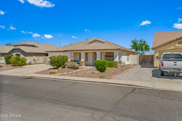 a view of a backyard with potted plants