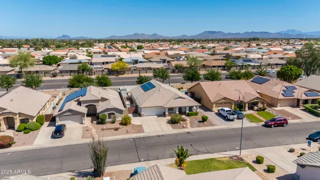 an aerial view of a house with a garden
