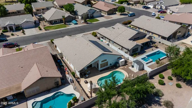 an aerial view of residential houses with outdoor space