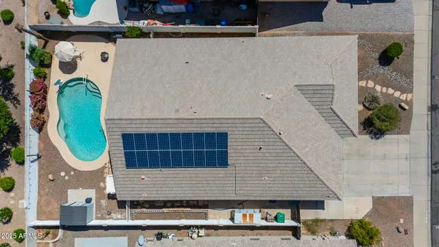 an aerial view of a house with wooden deck