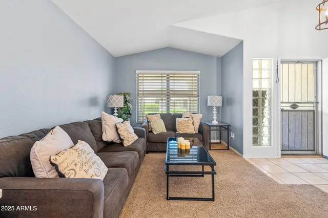 a view of a livingroom with furniture and white walls