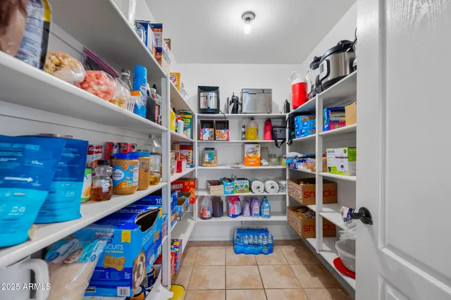 a kitchen with stainless steel appliances a refrigerator and a stove