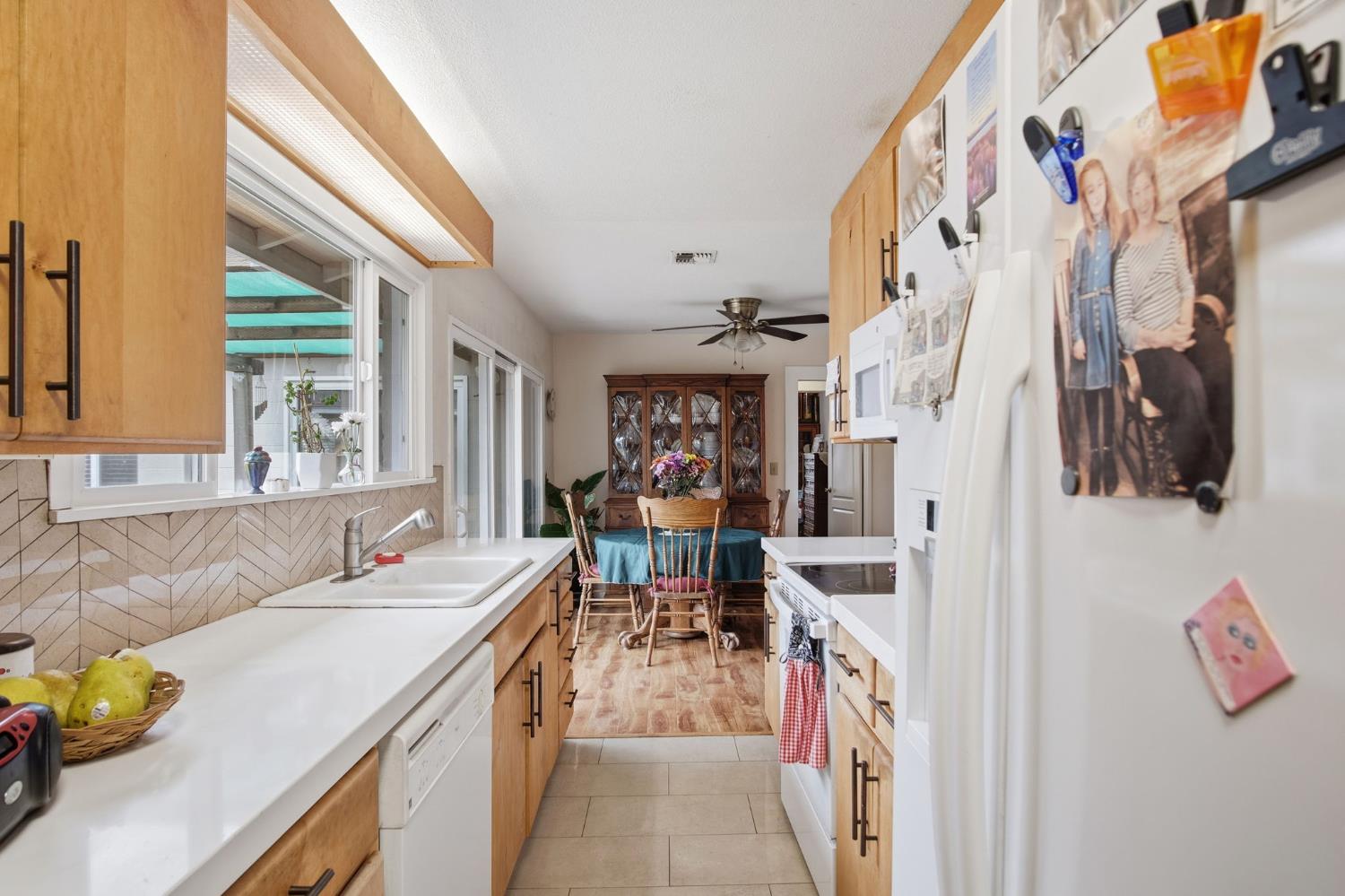 1740 Colorado Avenue Turlock, CA 95382 - Photo 14 of 37 a view of a kitchen with furniture and a window