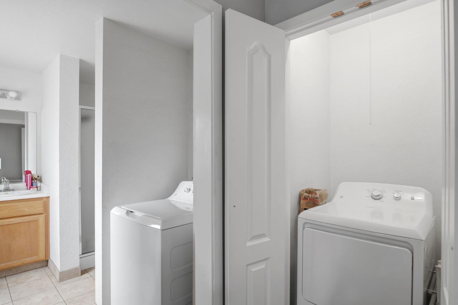 1740 Colorado Avenue Turlock, CA 95382 - Photo 16 of 37 a utility room with dryer and washer