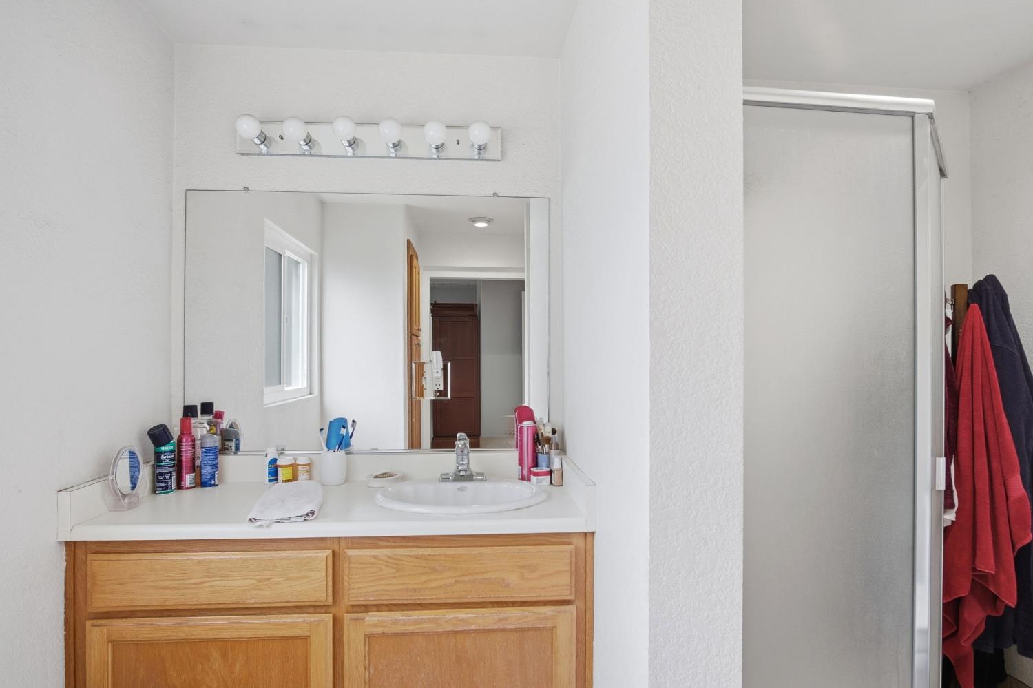 1740 Colorado Avenue Turlock, CA 95382 - Photo 18 of 37 a bathroom with a sink and a mirror