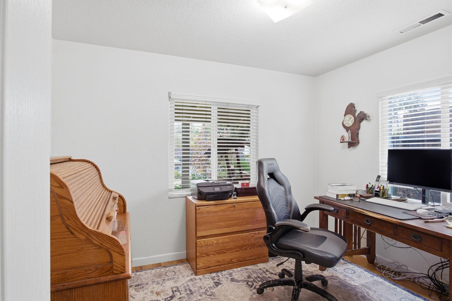 1740 Colorado Avenue Turlock, CA 95382 - Photo 21 of 37 a view of a workspace with furniture and a window