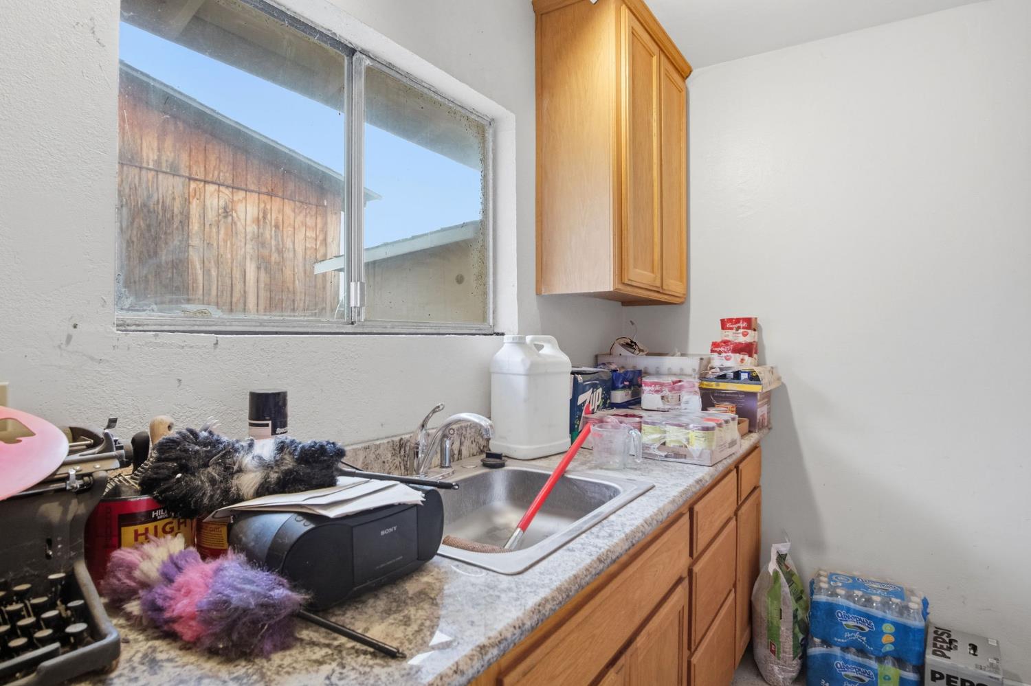 1740 Colorado Avenue Turlock, CA 95382 - Photo 28 of 37 a kitchen with a sink cabinets and appliances