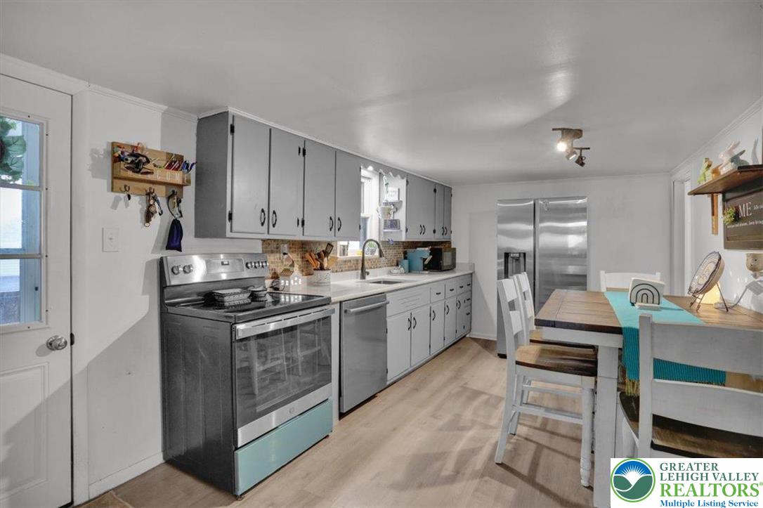 1825 Moselem Spring Road Hamburg, PA 19526 - Photo 11 of 24 a kitchen with a sink cabinets and window