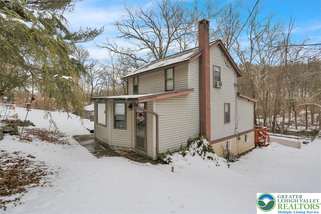 1825 Moselem Spring Road Hamburg, PA 19526 - Photo 2 of 24 a view of a house with snow on the road