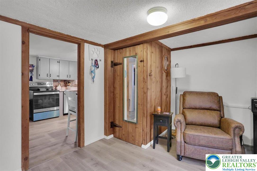 1825 Moselem Spring Road Hamburg, PA 19526 - Photo 9 of 24 a living room with furniture and a refrigerator