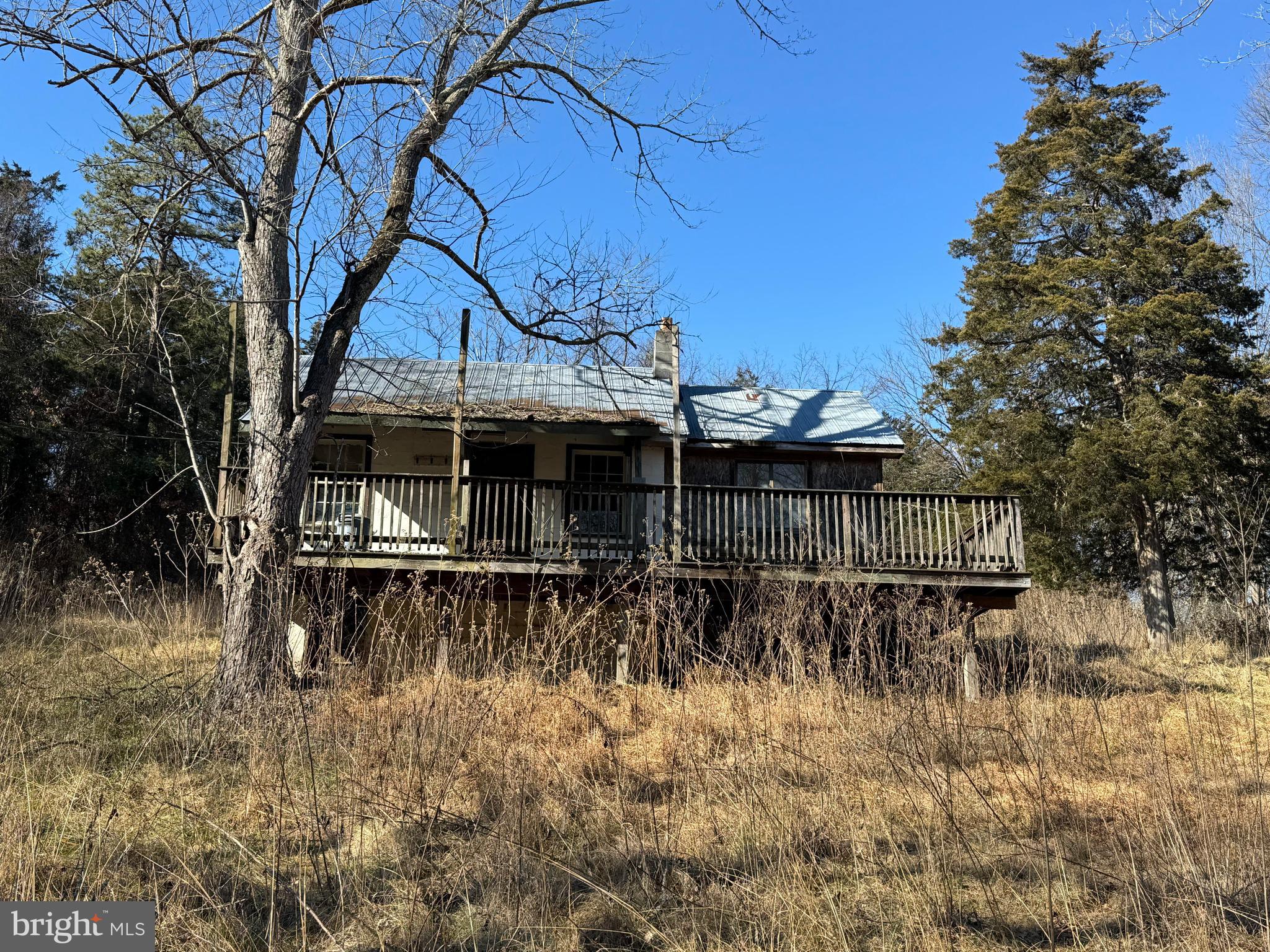 326 Thunderbird Road Front Royal, VA 22630 - Photo 27 of 44 a view of a house with a yard chairs and table in a patio