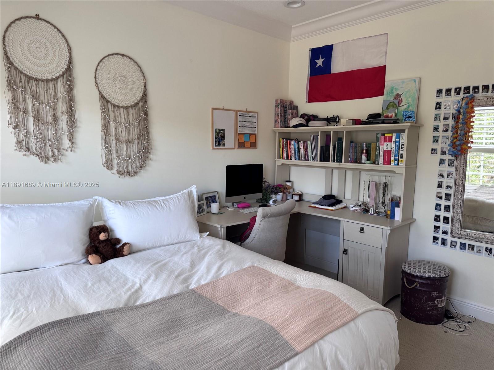 5565 Northeast Trieste Way Boca Raton, FL 33487 - Photo 18 of 30 a bedroom with a bed and wooden floor