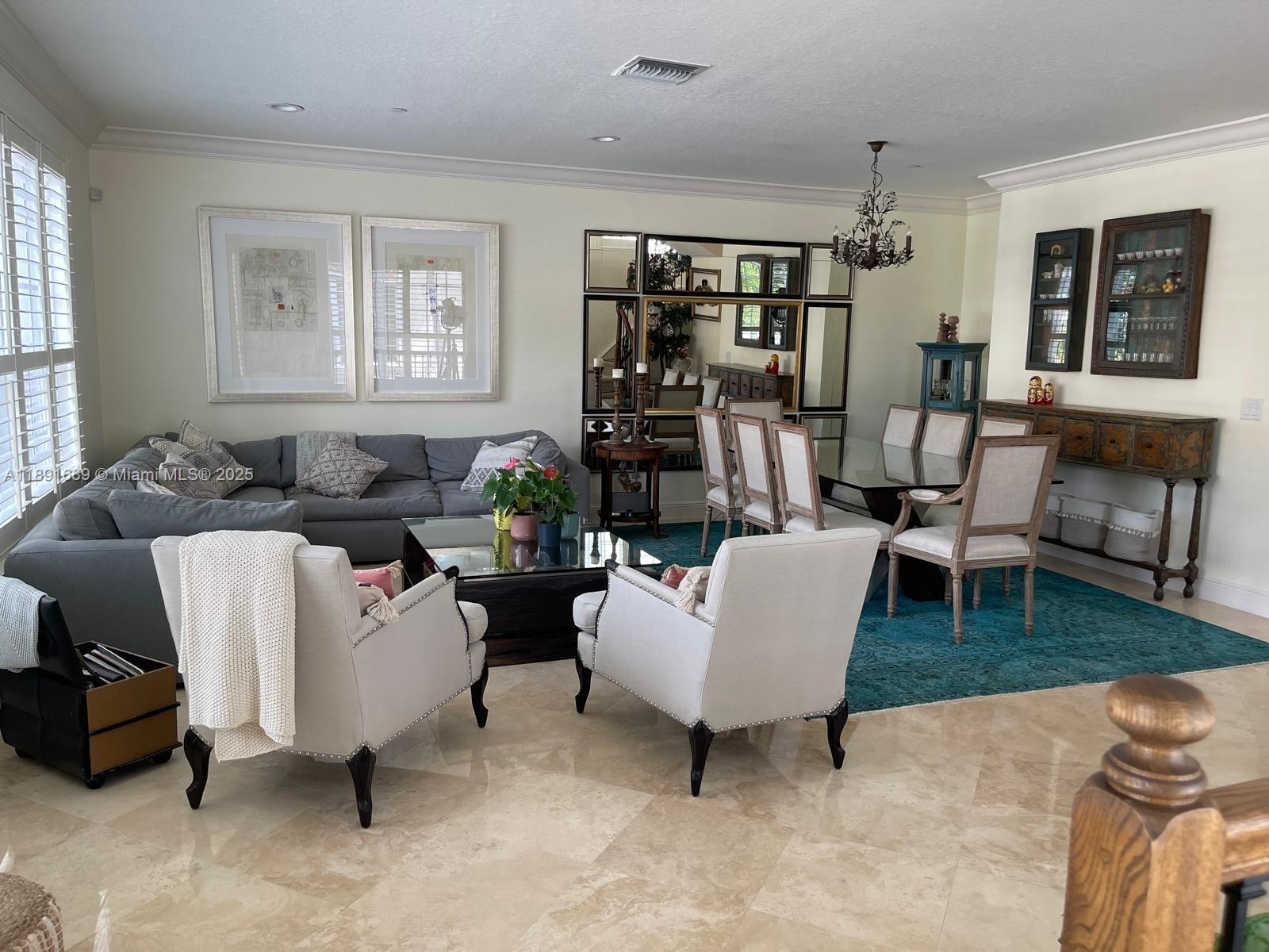 5565 Northeast Trieste Way Boca Raton, FL 33487 - Photo 10 of 30 a living room with furniture and a fireplace
