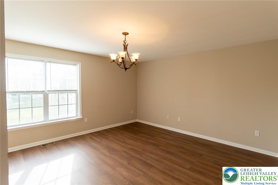 4138 Walter Road Bethlehem, PA 18020 - Photo 14 of 39 wooden floor in an empty room with a window