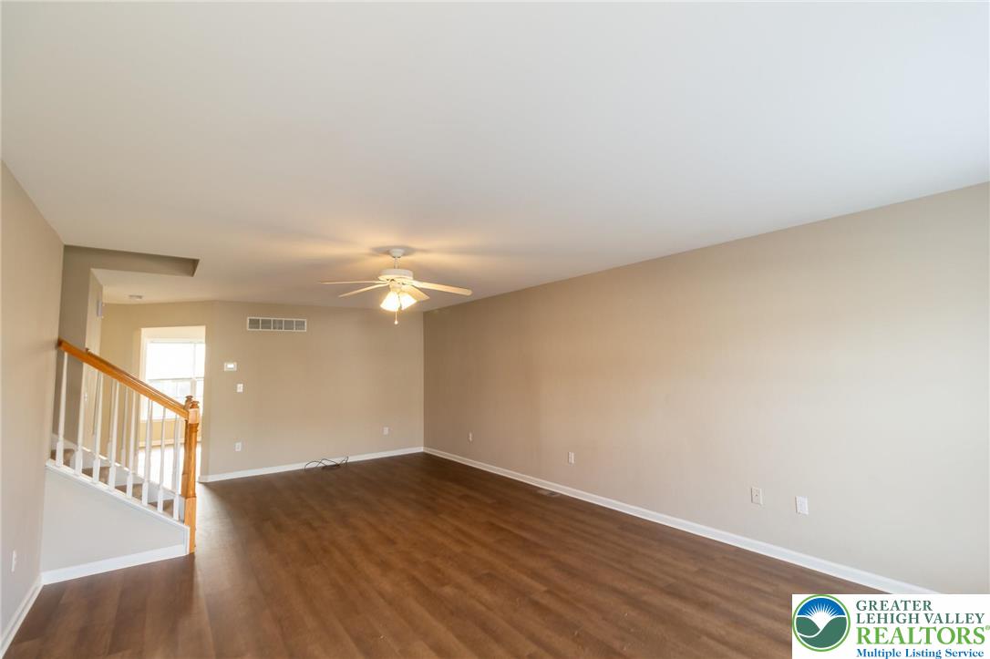 4138 Walter Road Bethlehem, PA 18020 - Photo 5 of 39 a view of an empty room with wooden floor and a window