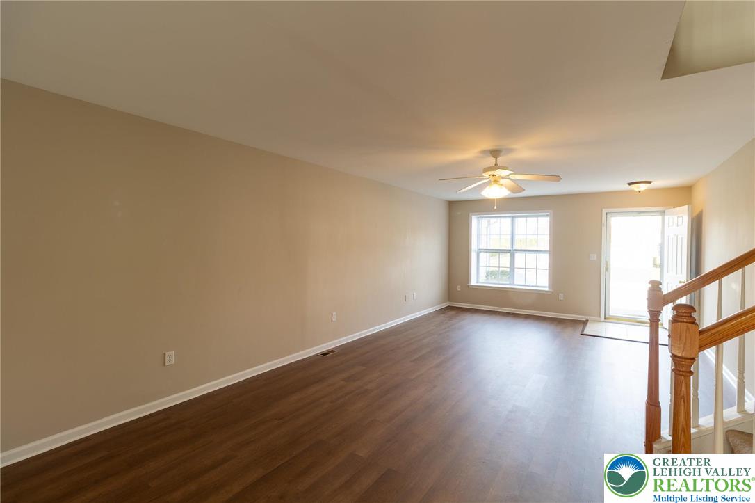 4138 Walter Road Bethlehem, PA 18020 - Photo 7 of 39 a view of an empty room with a window and wooden floor