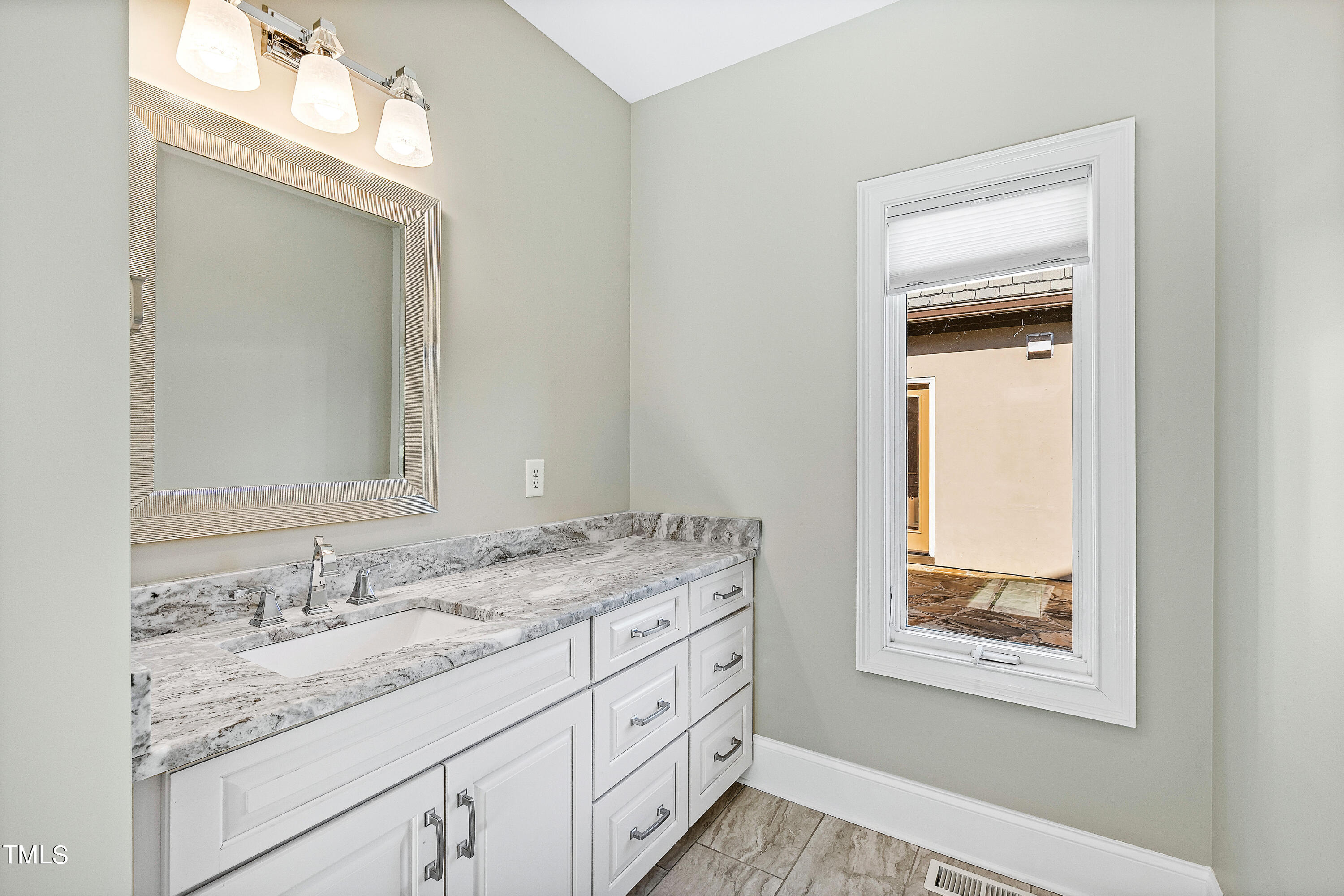 3700 Lark Farm Road Franklinton, NC 27525 - Photo 36 of 87 a bathroom with a granite countertop sink and a mirror
