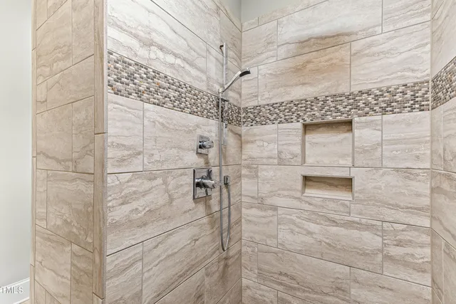 a kitchen with granite countertop a stove and cabinets