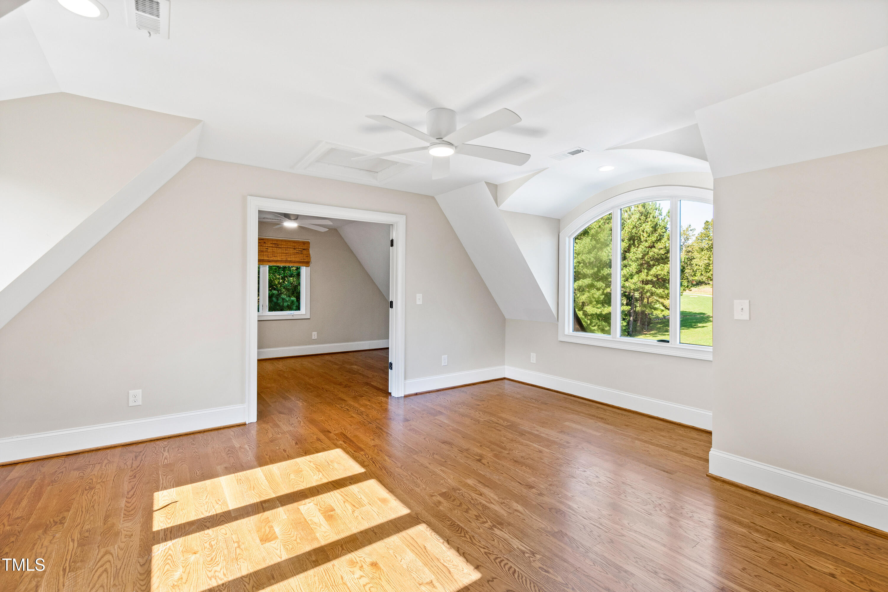 3700 Lark Farm Road Franklinton, NC 27525 - Photo 44 of 87 an empty room with wooden floor and windows