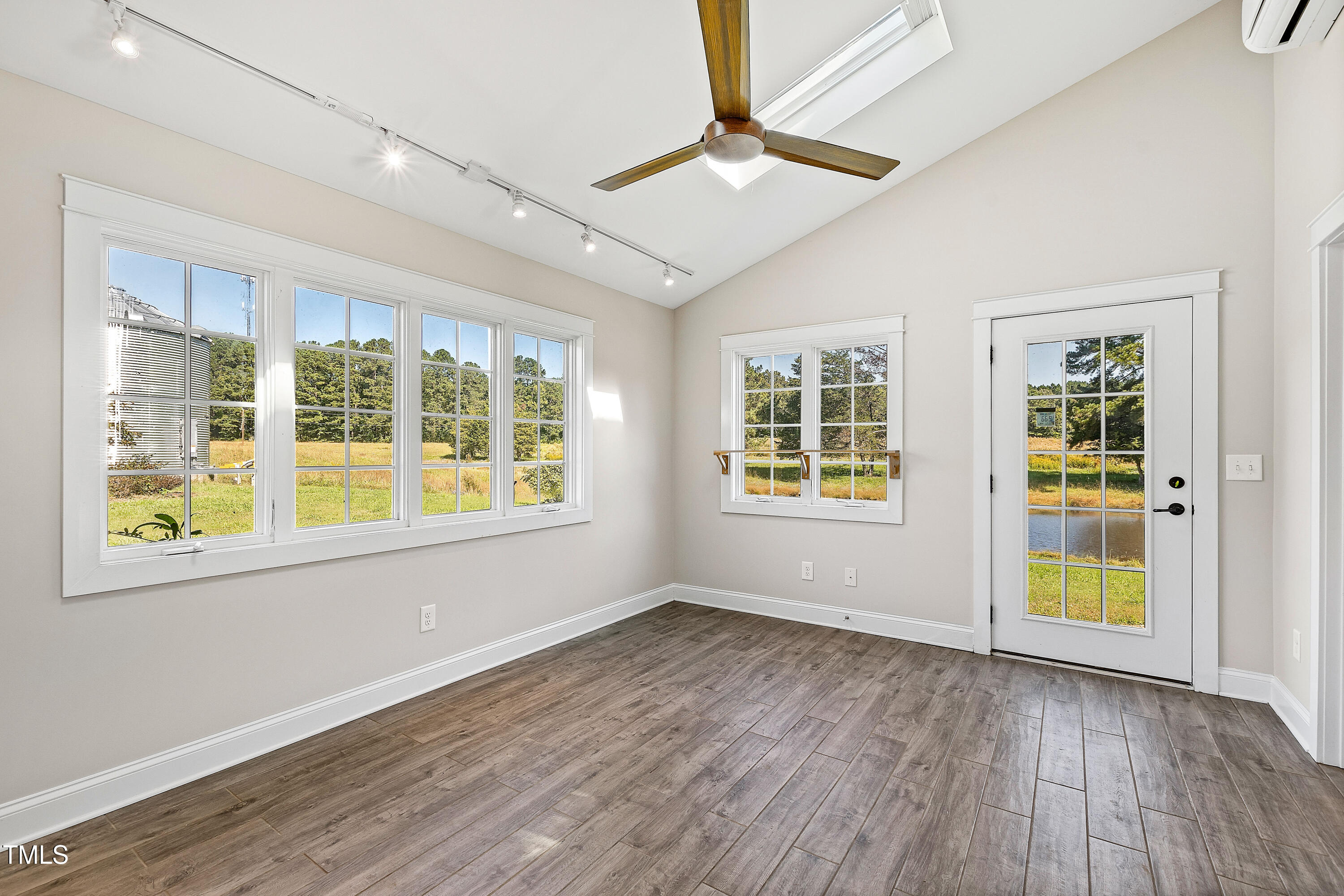 3700 Lark Farm Road Franklinton, NC 27525 - Photo 69 of 87 a view of an empty room with a window and wooden floor