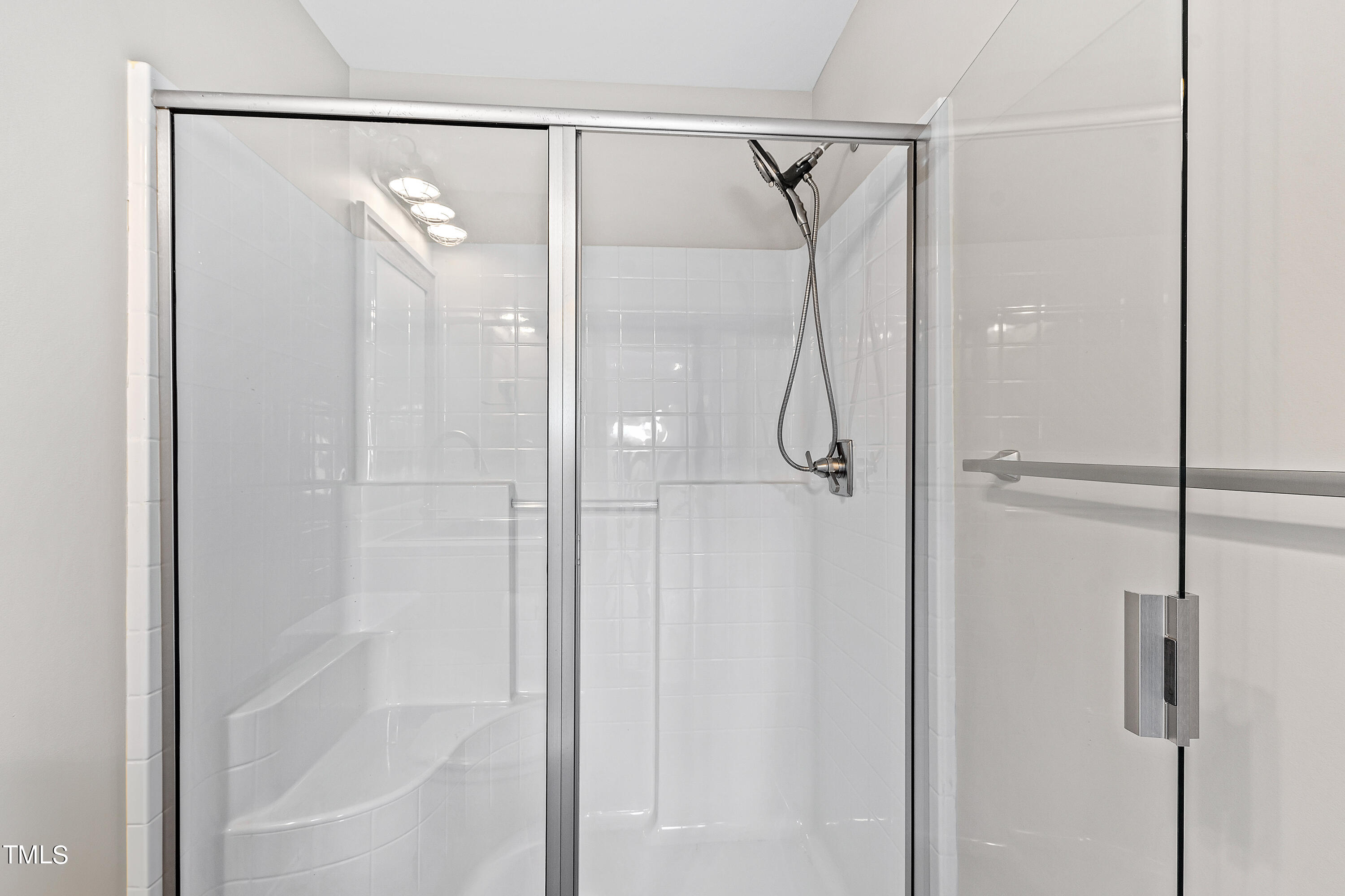 3700 Lark Farm Road Franklinton, NC 27525 - Photo 70 of 87 a bathroom with a glass shower door