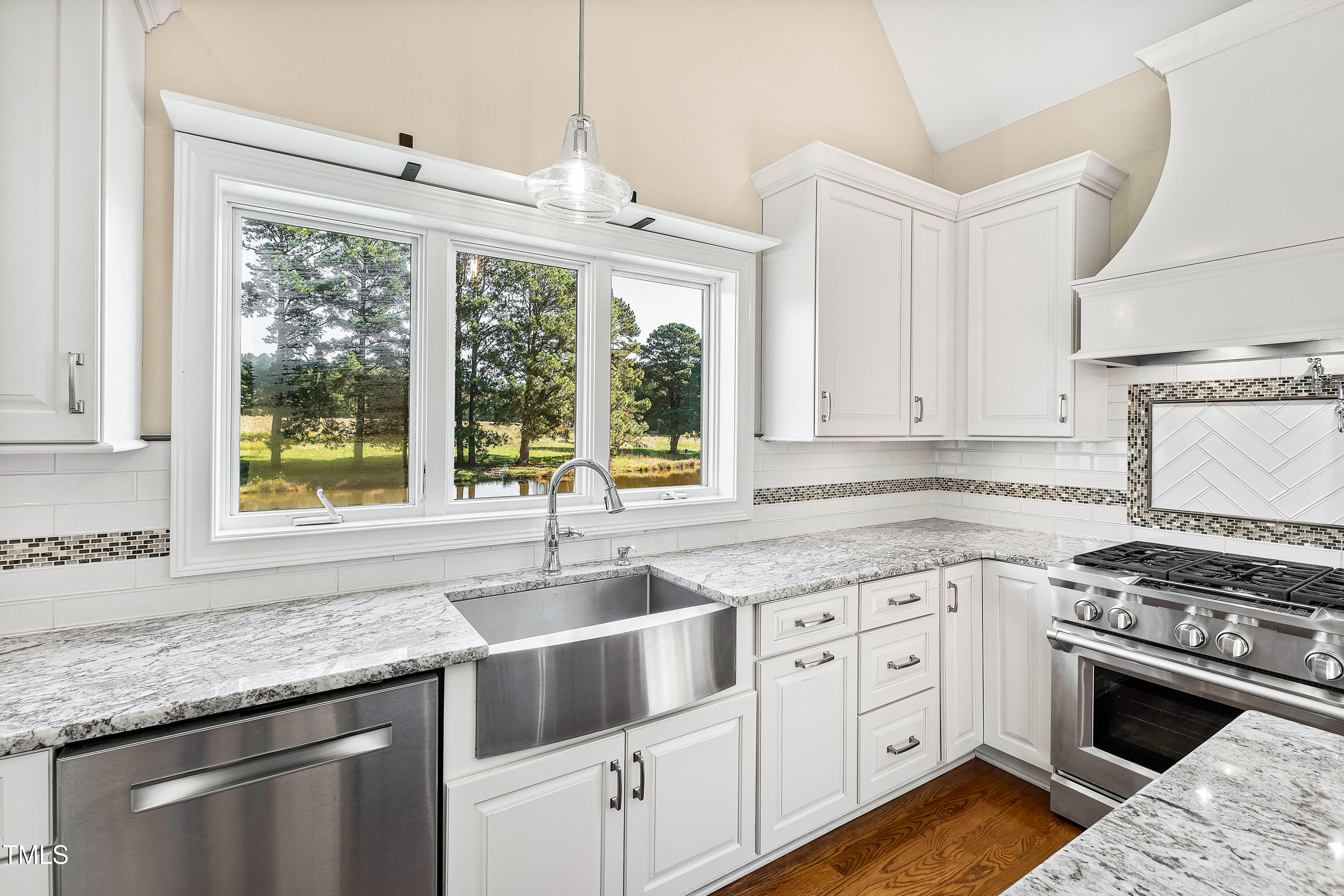 3700 Lark Farm Road Franklinton, NC 27525 - Photo 10 of 87 a kitchen with granite countertop a sink stainless steel appliances and cabinets