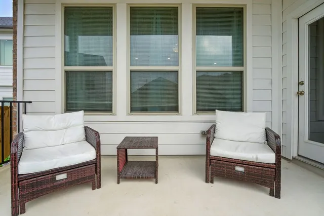 a house view with swimming pool in front of it