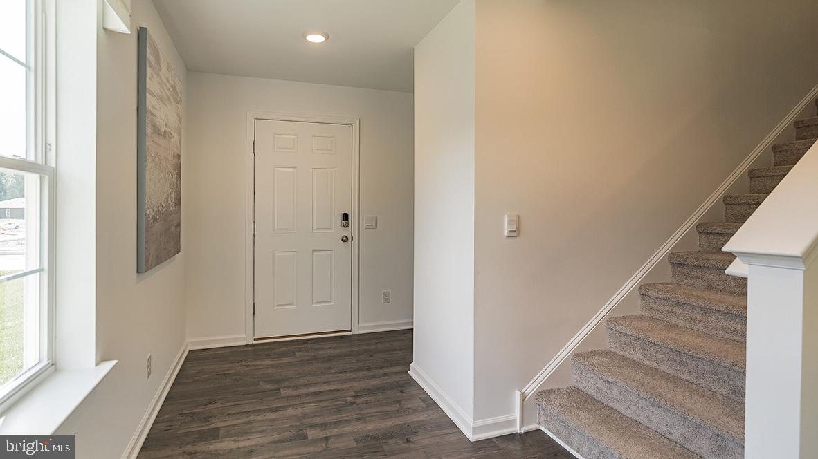 7 Watts Avenue Barnegat, NJ 08005 - Photo 2 of 20 a view of entryway with wooden floor and stairs